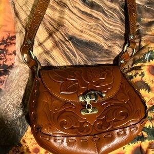 Patricia Nash women’s purse, whole-grain leather reddish brown with roses